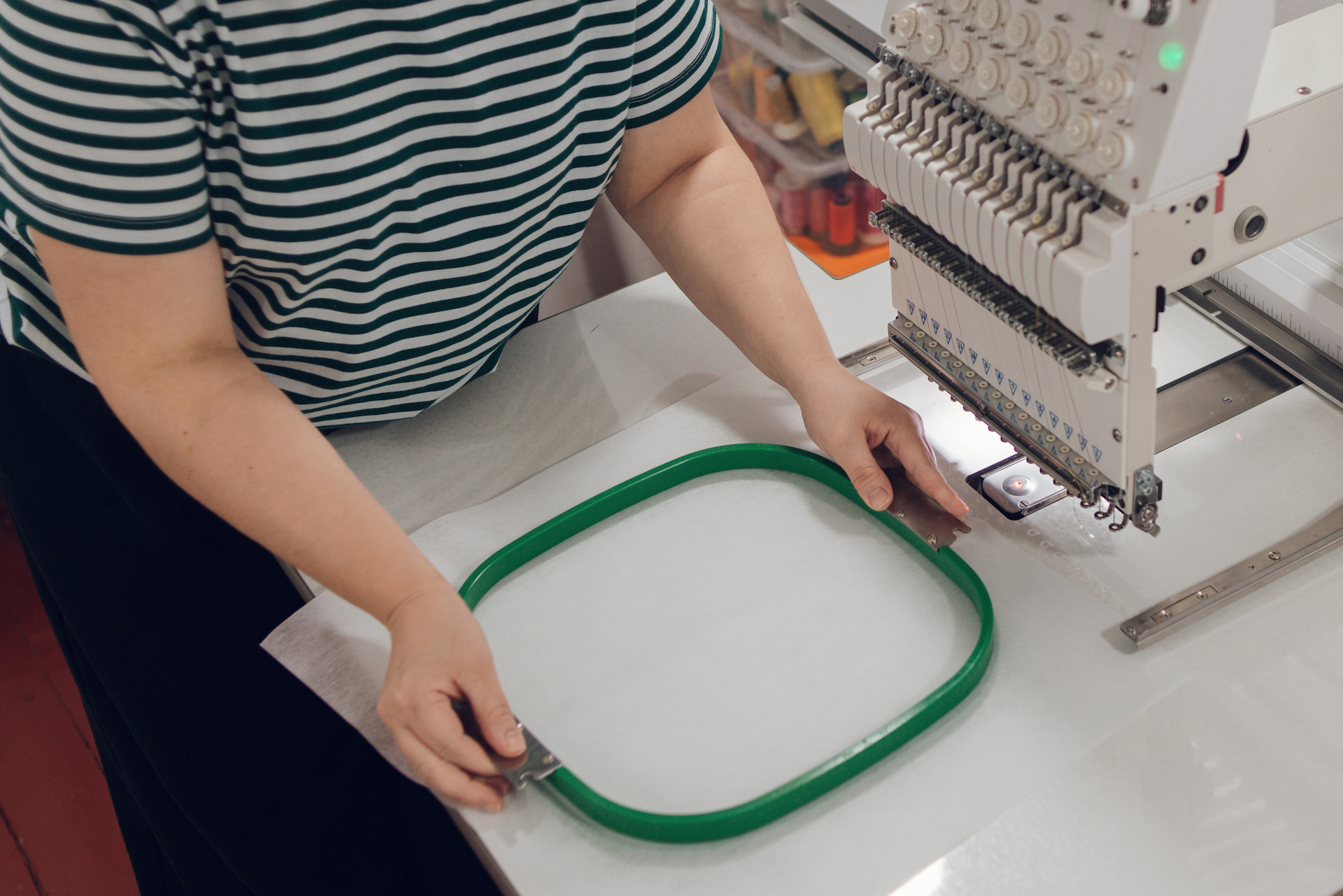 Commercial machine embroidery hooping