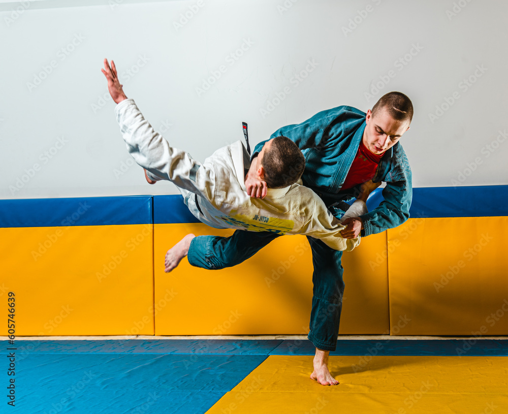 Martial arts athletes doing Jiu-jitsu