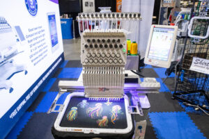 commercial single-head embroidery machine at Impressions Expos decorated-apparel trade show