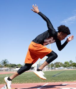 model wearing A4 athleisure compression tights and athletic shorts