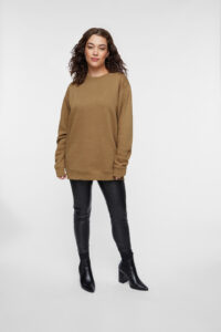 Female wearing oversized sweat shirt