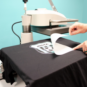 A swing away Heat Press for apparel decoration